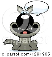 Clipart Of A Cartoon Happy Talking Sitting Wolf Royalty Free Vector Illustration
