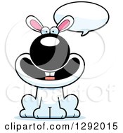 Clipart Of A Cartoon Happy Talking White Rabbit Sitting Royalty Free Vector Illustration