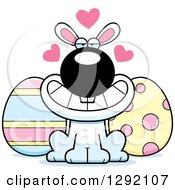 Clipart Of A Cartoon Loving White Easter Bunny With Eggs And Love Hearts Royalty Free Vector Illustration by Cory Thoman