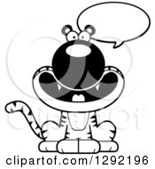 Wild Animal Clipart Of A Black And White Cartoon Happy Talking Sitting Tiger Big Cat Royalty Free Lineart Vector Illustration