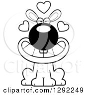 Animal Clipart Of A Black And White Cartoon Loving Rabbit Sitting With Hearts Royalty Free Lineart Vector Illustration