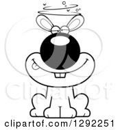Animal Clipart Of A Black And White Cartoon Drunk Or Dizzy Rabbit Sitting Royalty Free Lineart Vector Illustration