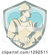 Poster, Art Print Of Retro Male Construction Worker Holding A Giant Wrench In A Pastel Shield