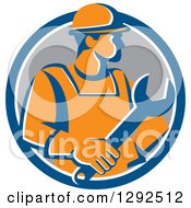 Poster, Art Print Of Retro Orange Male Construction Worker Holding A Giant Wrench In A Blue White And Gray Circle