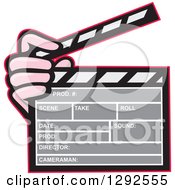 Cartoon Hand Holding A Clapperboard