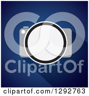 Clipart Of A Flat Design Of A Digital Camera And Shadow On Blue Royalty Free Vector Illustration