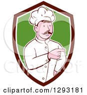 Retro Cartoon White Male Head Chef With A Mustache Pointing In A Brown White And Green Shield