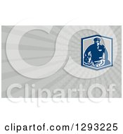 Clipart Of A Retro Blue Guard Dog And Security Officer And Gray Rays Background Or Business Card Design Royalty Free Illustration