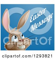 Holiday Clipart Of A Happy Brown Easter Bunny Rabbit Looking Up To Sample Text On Blue Royalty Free Vector Illustration