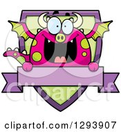 Poster, Art Print Of Badge Or Label Of A Happy Dragon Over A Shield And Blank Banner