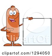 Cartoon Happy Sausage Character Standing By And Pointing To A Blank Sign