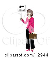 Young Beautiful Female Real Estate Agent Realtor Holding A Sold Sign And A Briefcase