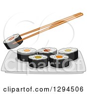 Chopsticks Holding A Roll Over A Plate Of Makizushi Sushi