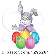 Poster, Art Print Of Happy Gray Easter Bunny Rabbit Waving Behind Colorful Easter Eggs