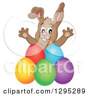 Poster, Art Print Of Happy Brown Easter Bunny Rabbit Popping Out Behind Colorful Easter Eggs