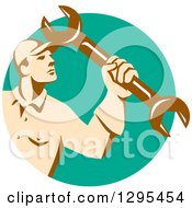Clipart Of A Retro Male Mechanic Holding Up A Wrench In A Turquoise Circle Royalty Free Vector Illustration