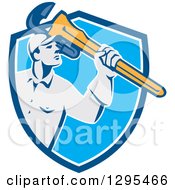 Clipart Of A Retro Male Plumber Holding A Giant Monkey Wrench In A Blue And White Shield Royalty Free Vector Illustration