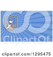 Clipart Of A Retro Woodcut Male Plumber Holding A Monkey Wrench And Blue Rays Background Or Business Card Design Royalty Free Illustration