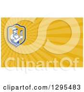 Clipart Of A Retro Male Plumber Holding A Monkey Wrench And Yellow Rays Background Or Business Card Design Royalty Free Illustration