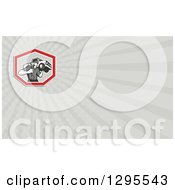 Clipart Of A Retro Mechanic Carrying A Wrench And Pickup Truck And Gray Rays Background Or Business Card Design Royalty Free Illustration