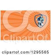Clipart Of A Retro Rugby Player And Orange Rays Background Or Business Card Design Royalty Free Illustration