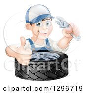Clipart Of A Happy Young Brunette White Mechanic Man Wearing A Baseball Cap Holding A Wrench And Thumb Up Over A Tire Royalty Free Vector Illustration by AtStockIllustration
