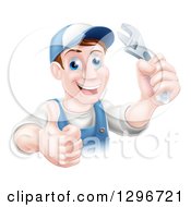 Poster, Art Print Of Happy Brunette Middle Aged Caucasian Mechanic Man Wearing A Baseball Cap Holding A Wrench And Thumb Up