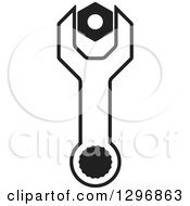 Clipart Of A Black And White Wrench With A Nut Royalty Free Vector Illustration