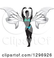 Poster, Art Print Of Silhouetted Stretching Female Bodybuilder With Silver Butterfly Wings In A Gradient Suit