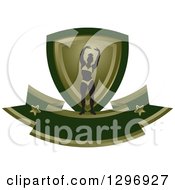 Clipart Of A Silhouetted Flexing Female Bodybuilder With A Green And Gold Shield And Blank Banner Royalty Free Vector Illustration