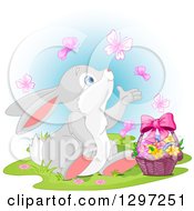 Poster, Art Print Of Adorable Bunny Rabbit Watching Butterflies And Sitting With An Easter Basket Over Blue