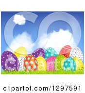 Poster, Art Print Of 3d Colorful Shiny Patterned Easter Eggs In Grass Under A Blue Sky With Clouds