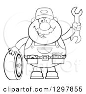 Poster, Art Print Of Cartoon Black And White Male Mechanic Wearing A Tool Belt Waving With A Wrench And Standing With A Tire
