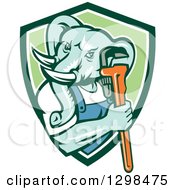 Clipart Of A Retro Woodcut Muscular Turquoise Elephant Man Plumber Holding A Wrench In A Green And White Shield Royalty Free Vector Illustration