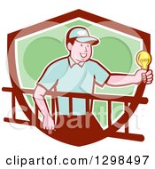 Poster, Art Print Of Retro Cartoon White Male Electrician Carrying A Ladder And Holding A Light Bulb In A Maroon White And Green Shield