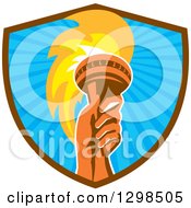 Clipart Of A Red Hand Holding Up A Torch In A Brown And Blue Ray Shield Royalty Free Vector Illustration