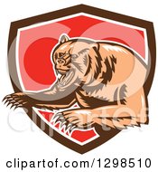 Poster, Art Print Of Retro Woodcut Vicious Grizzly Bear Emerging From A Brown White And Red Shield