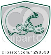 Football Helmet In A Green White And Gray Shield