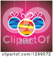 Poster, Art Print Of Ribbon Patterned Baubles Suspended Over Pink With Merry Christmas Text