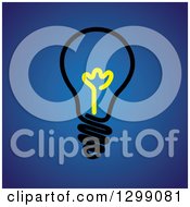 Poster, Art Print Of Black Light Bulb With A Yellow Center On Blue