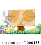Poster, Art Print Of Gray Easter Bunny Rabbit With Eggs Sitting In A Shell By A Blank Wood Sign
