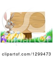 Poster, Art Print Of Brown Easter Bunny Rabbit With Eggs Sitting In A Shell By A Blank Wood Sign