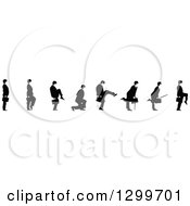 Clipart of a Black and White Businessman Shown in Profile, in Diferent Poses, Facing Right - Royalty Free Vector Illustration by pauloribau #COLLC1299701-0129