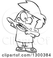 Lineart Clipart Of A Cartoon Bratty Black And White Boy Making A Funny Face Royalty Free Outline Vector Illustration by toonaday