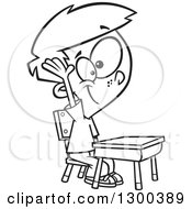 Lineart Clipart Of A Cartoon Black And White School Boy Raising His Hand At A Desk Royalty Free Outline Vector Illustration