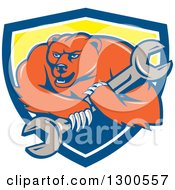 Cartoon Roaring Angry Grizzly Bear Mechanic Mascot Carrying A Giant Wrench In A Blue White And Yellow Shield