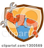 Poster, Art Print Of Cartoon Bulldog Mechanic Holding Out A Wrench And Emerging From A Brown White And Orange Shield