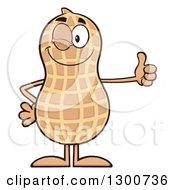 Happy Peanut Mascot Character Winking And Giving A Thumb Up by Hit Toon
