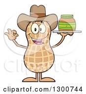 Happy Cowboy Peanut Mascot Character Gesturing Ok And Holding A Jar Of Butter