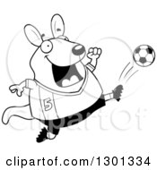 Outline Clipart Of A Cartoon Black And White Chubby Wallaby Kicking A Soccer Ball Royalty Free Lineart Vector Illustration by Cory Thoman